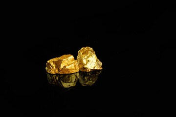 Closeup of big gold nugget finance concept