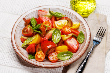 Tomato salad with fresh basil and olive oil