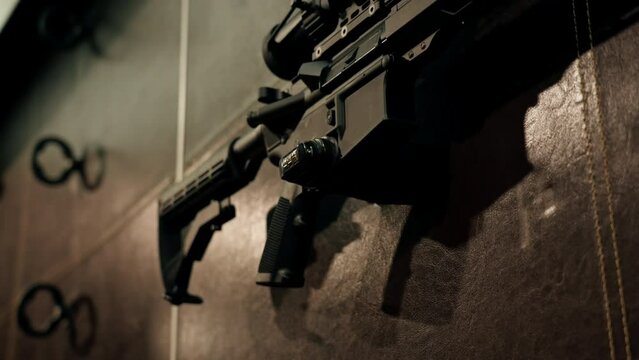 close-up at a professional shooting range stand with professional long-range NATO weapons