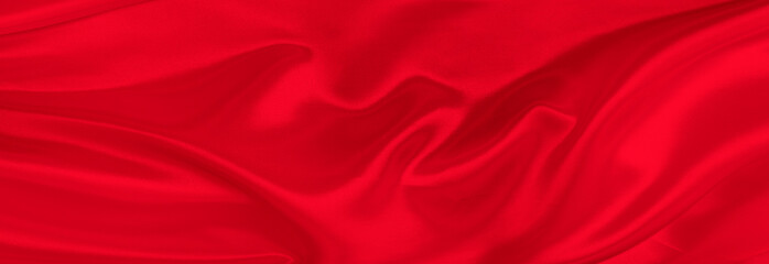 Black red satin dark fabric texture luxurious shiny that is abstract silk cloth background with patterns soft waves blur beautiful.