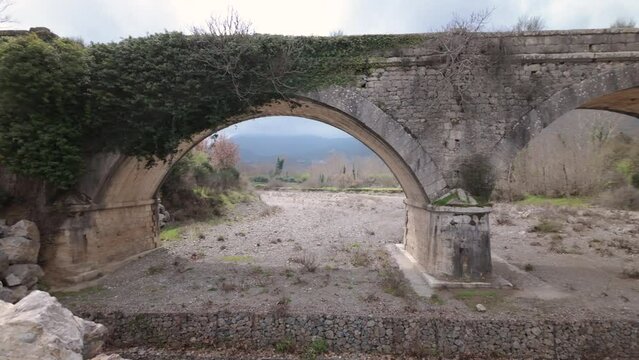 Abandoned Stone Arch Bridge In Falaisia Region, Greece. Panning Right Shot