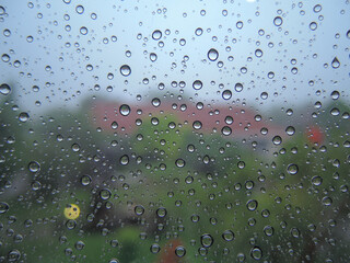 The texture of water droplets on an ofgice window