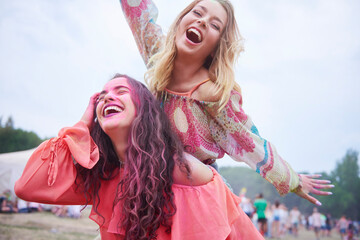 Playful friends having fun at the music festival