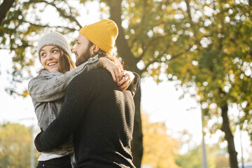 Happy young couple embracing in a city park, Berlin, Germany