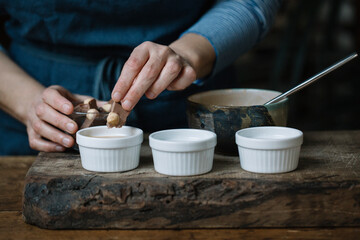 Woman preparing dessert, partial view