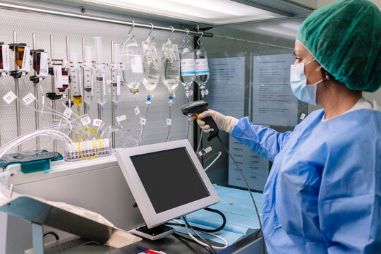 Female doctor scanning drips in laboratory