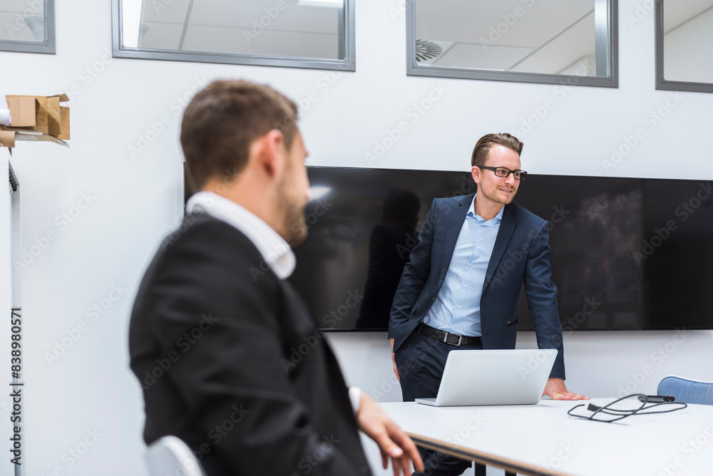 Wall mural business people having a meeting in conference room