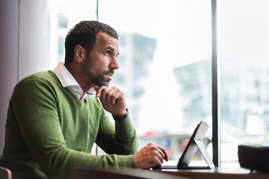 Business man using tablet in cafe