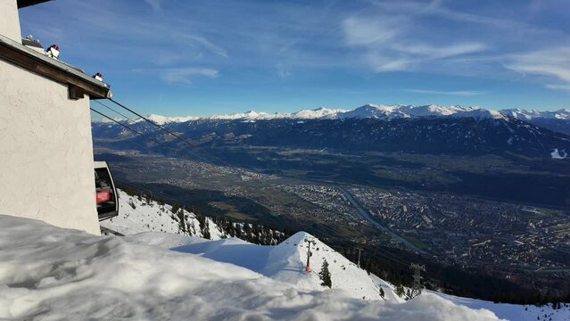 Alpine ski resort Nordkette on a sunny day. Arrival with the cable car at the Innsbruck valley station, Tyrol, Austria