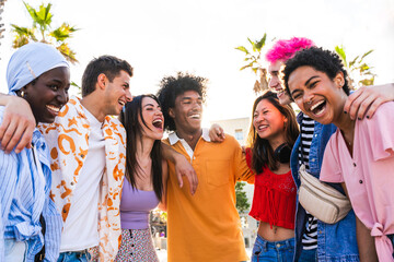 Multiethnic group of young happy friends hanging out in the city - Multiracial group of students...