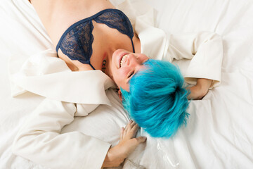 Grunge lesbian woman lying on bed