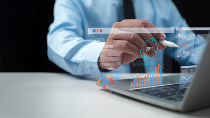 Businessman use computers to analyze business and manage corporate data, Business analytics with charts, Metrics and KPIs to improve organizational performance, financial organization strategy.