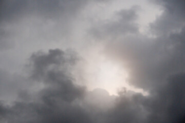 Abstact of nature background of dark sky before rainy time. With light of sun survive.