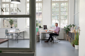 Man working at desk in a loft office