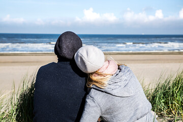 Couple sitting in dunes
