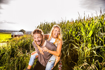 Carefree couple in cornfield