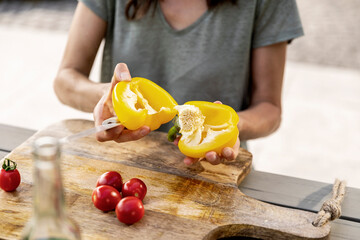 Close-up of woman preparing healthy food outdoors
