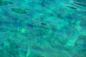 Turquoise clear sea surface summer background