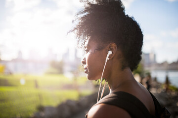 Woman listening to music outdoors