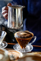 Steam rises from a pour-over coffee in a school bus cafe in Fujikawaguchiko, Japan, during winter.