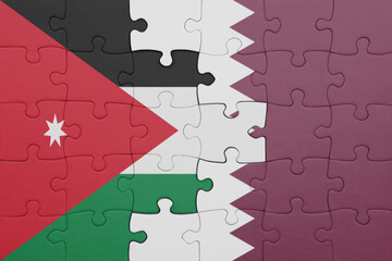 puzzle with the colourful national flag of qatar and flag of jordan .