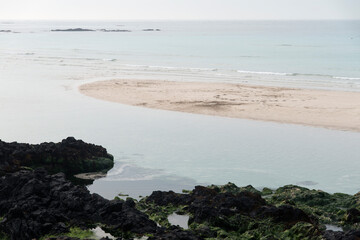 View of the sand beach on a cloudy day