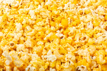 Delicious popcorn isolated on white background. Cinema and entertainment concept. Movie night with popcorn. Cheese and caramel popcorn. Delicious appetizer, snack. Banner