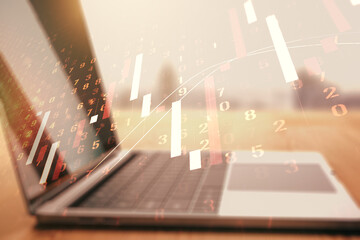 Multi exposure of abstract financial graph on laptop background, financial and trading concept