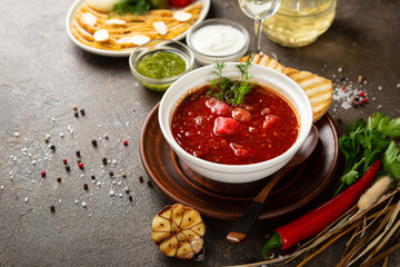 red borscht soup in a white bowl soup food on light wood