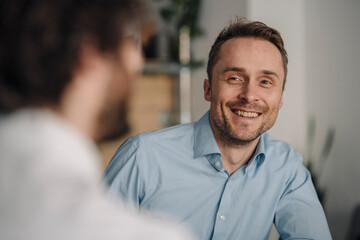 Two businessmen having a meeting in a coffee shop