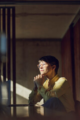 Businesswoman sitting in her sustainable office, portrait