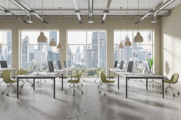 An open-plan office with modern furniture and computers placed near large windows overlooking a city skyline, bright workspace, concept of contemporary office interior.  3D Rendering