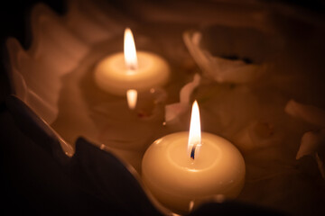 the burning candle on a  table