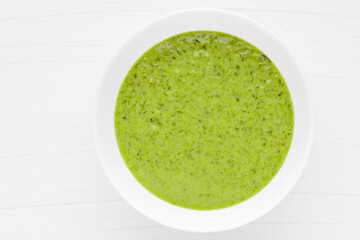 Green soup. Broccoli spinach cream soup in a bowl.