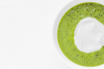 Green soup. Broccoli spinach cream soup in a bowl.