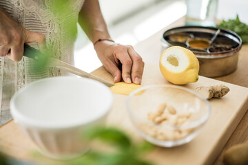 Woman preparing healthy food in her kitchen