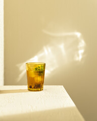a beautiful glass with a cold drink in the sunlight