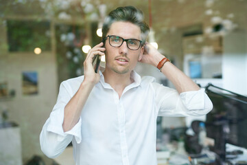 Portrait of businessman on the phone