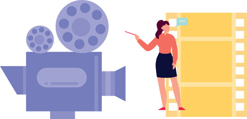 The girl is pointing at the cinema camera.