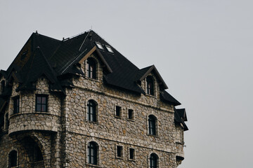 The stone house looks like a castle - hotel on the territory of an ethno village Stanisici in...