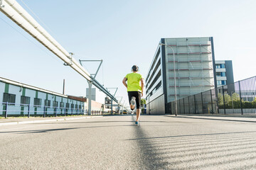 Young athlete jogging in the city