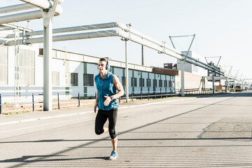 Young athlete jogging in the city