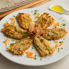 Tapa of anchovies battered with flour and egg in a Spanish restaurant. Traditional tapa of Spanish gastronomy.