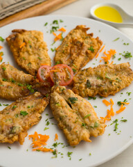 Tapa of anchovies battered with flour and egg in a Spanish restaurant. Traditional tapa of Spanish gastronomy.