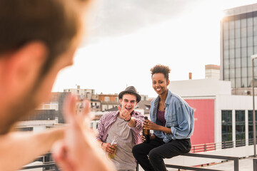 Friends meeting on a rooftop party