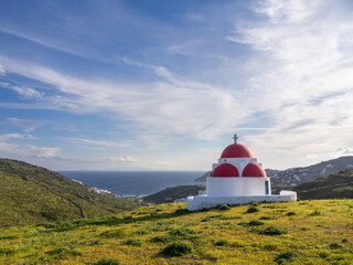 A small Greek church on the island of Mykonos overlooking the sea