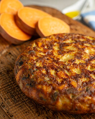 Spanish omelette with sweet potato, onion and egg. Traditional tapa of Spanish gastronomy.