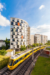 Germany, Stuttgart, high-rise residential building and tram