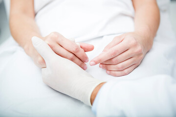 Doctor holding patient's hand