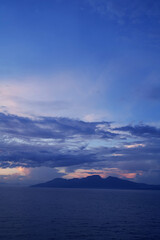 A mountain view from the middle of the sea in the early morning